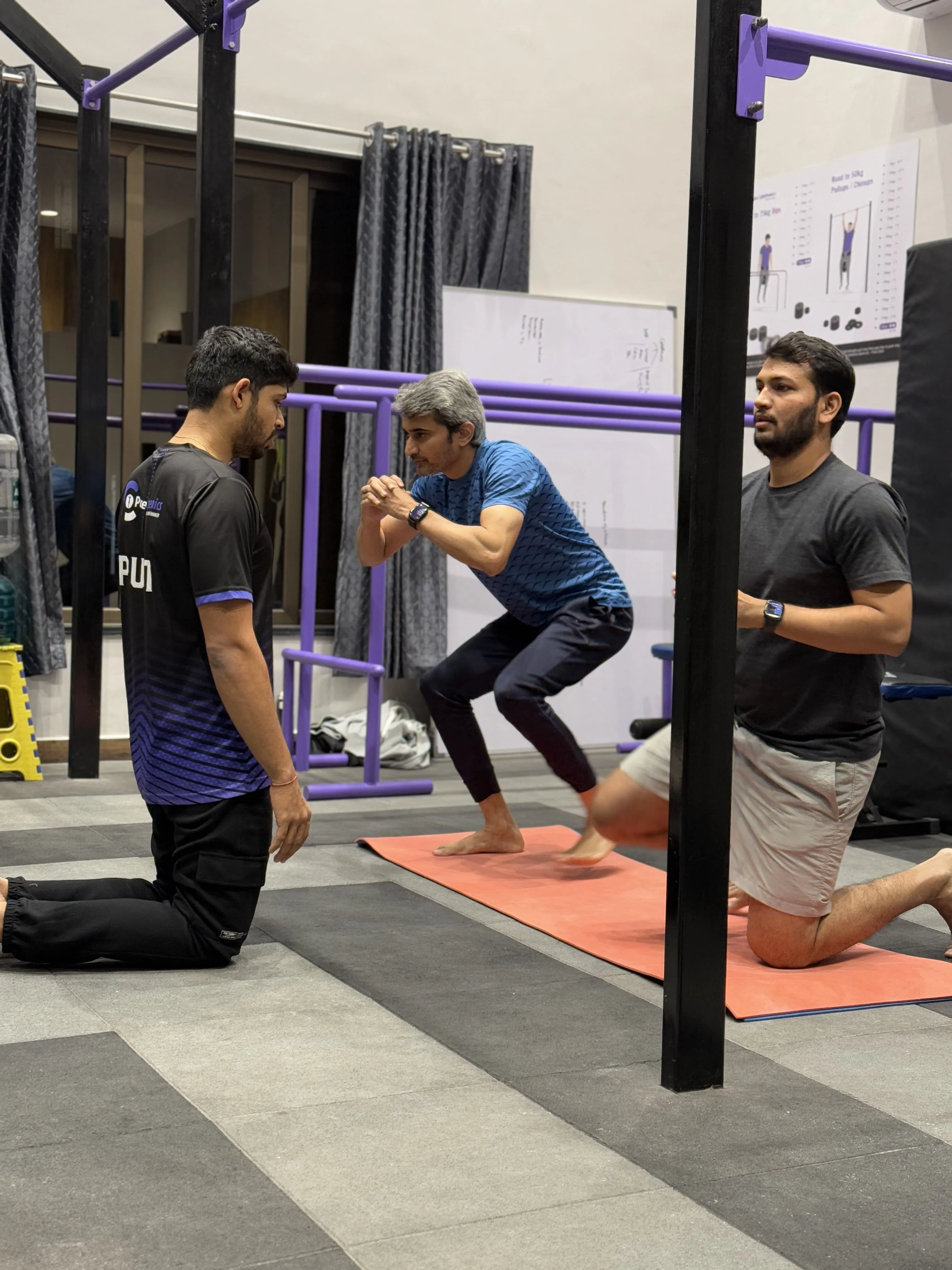 Pure Calisthenics trainer coaching movement form